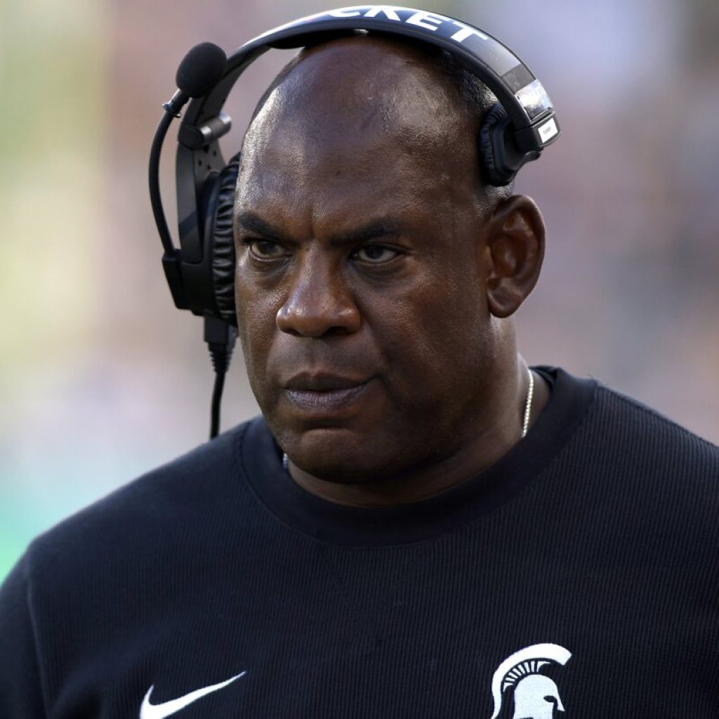 Michigan State suspends coach Mel Tucker after allegations he sexually harassed a rape survivor | AP News