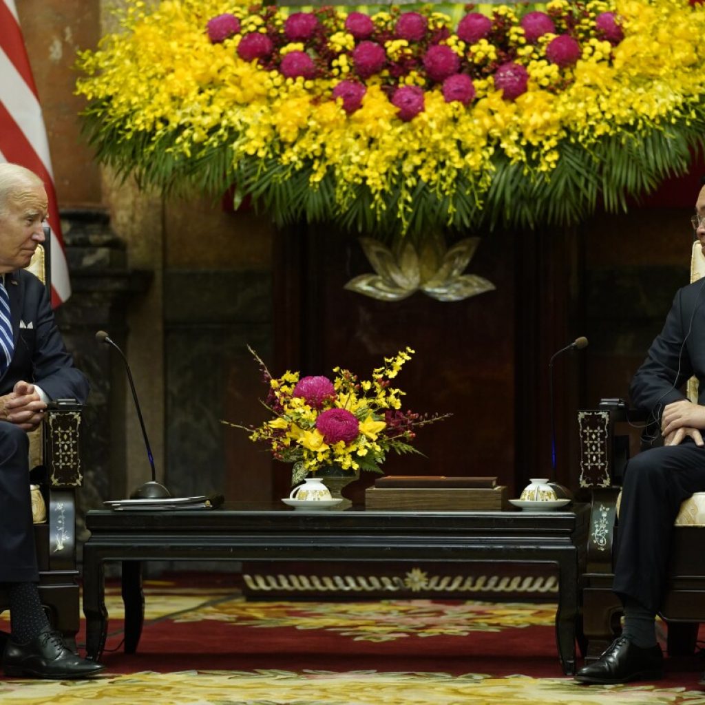 Biden highlights business deals and pays respects at John McCain memorial to wrap up Vietnam visit | AP News