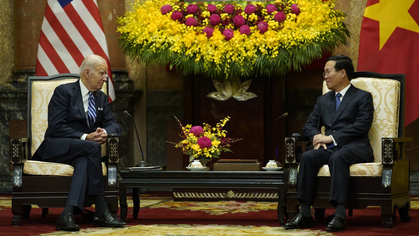 Biden highlights business deals and pays respects at John McCain memorial to wrap up Vietnam visit | AP News