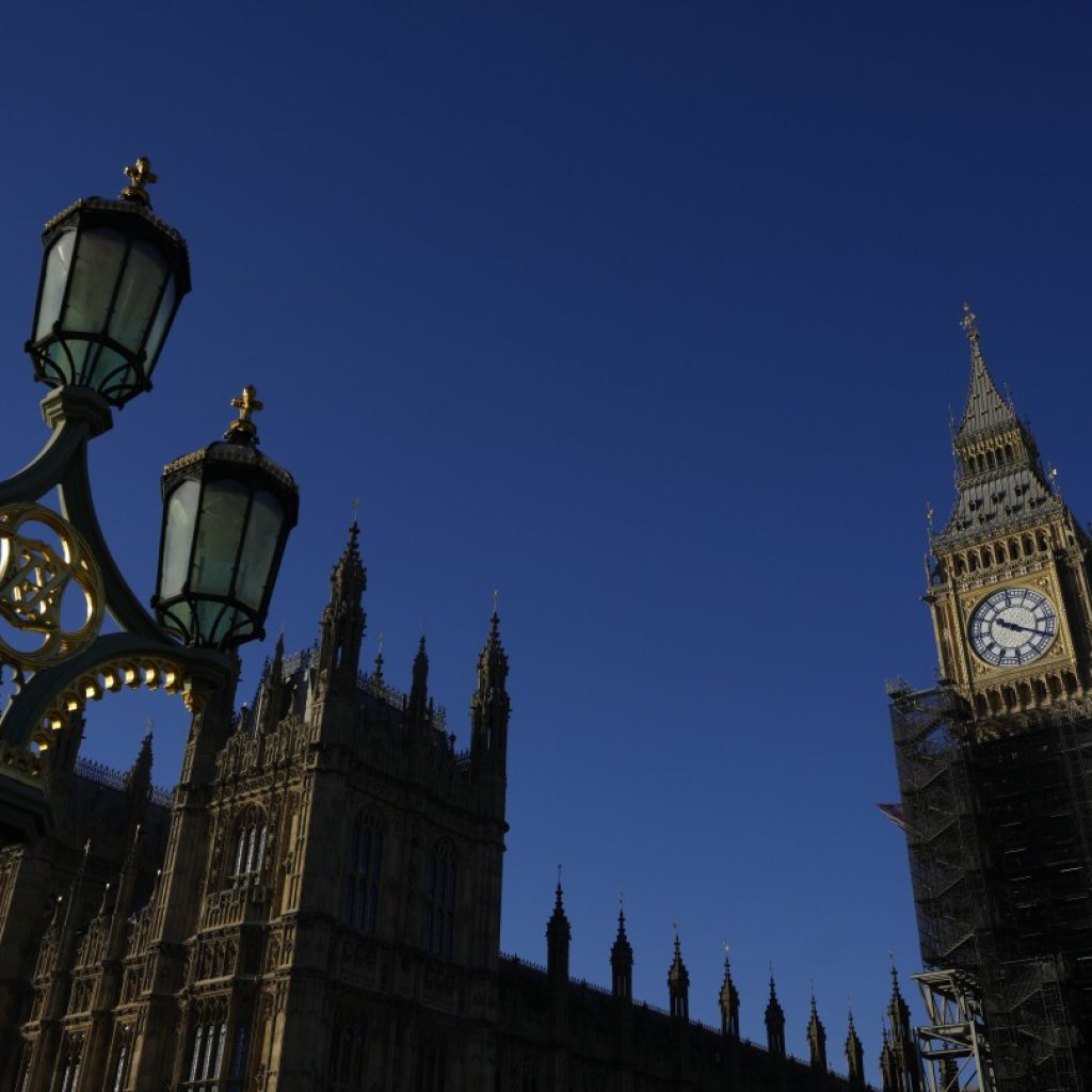 UK resists calls to label China a threat following claims a Beijing spy worked in Parliament | AP News