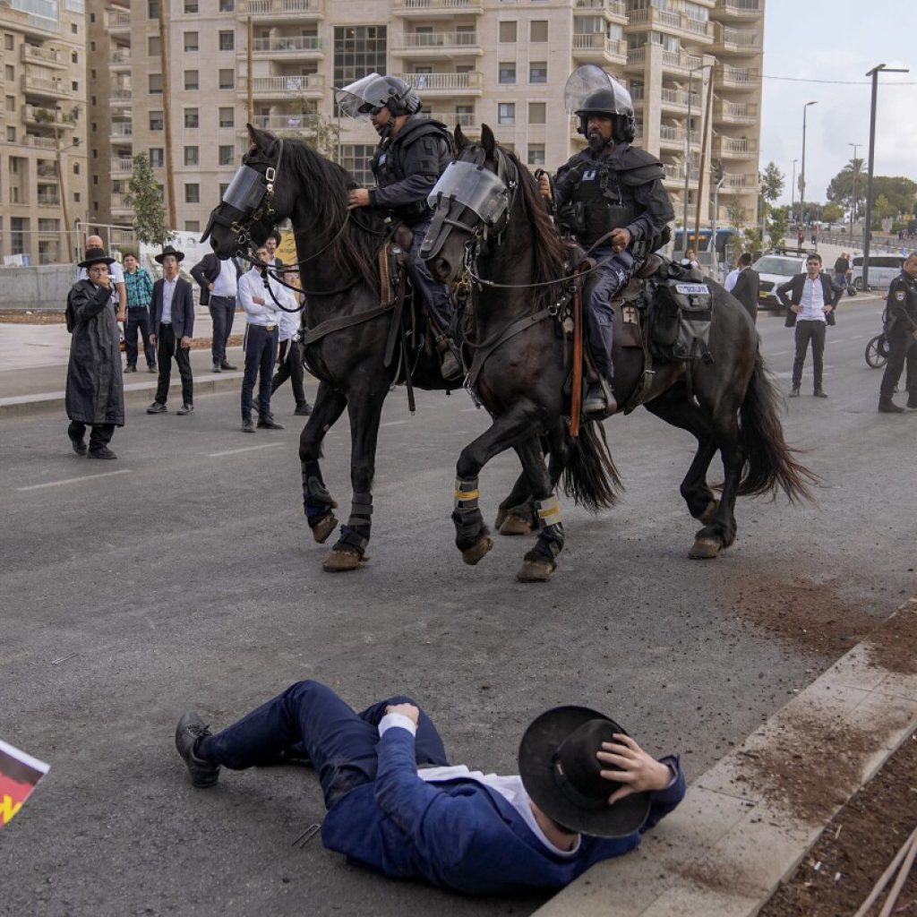 Ultra-Orthodox men block Jerusalem traffic in protest against Israeli military draft | AP News