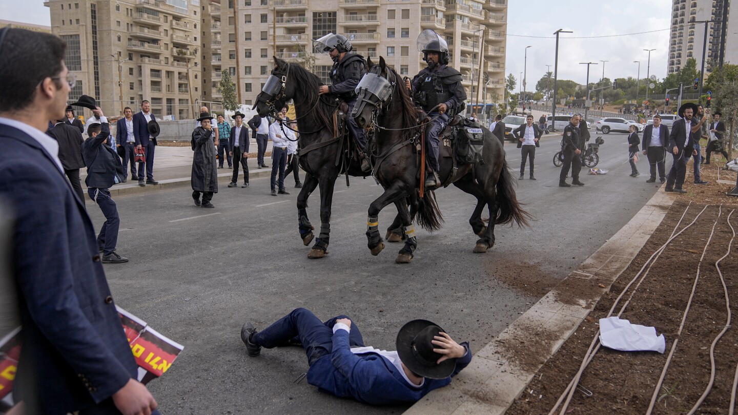 Ultra-Orthodox men block Jerusalem traffic in protest against Israeli military draft | AP News