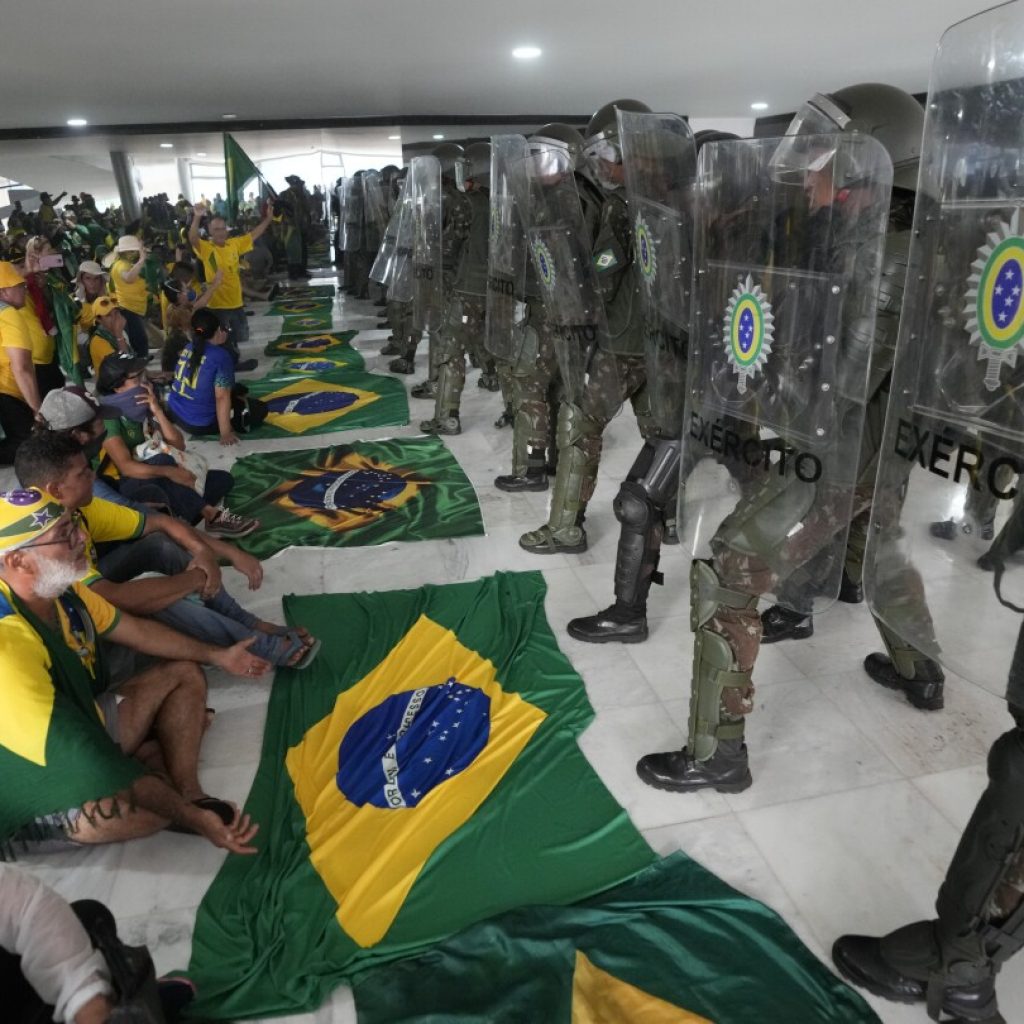 Pro-Bolsonaro rioters on trial for storming Brazil’s top government offices | AP News