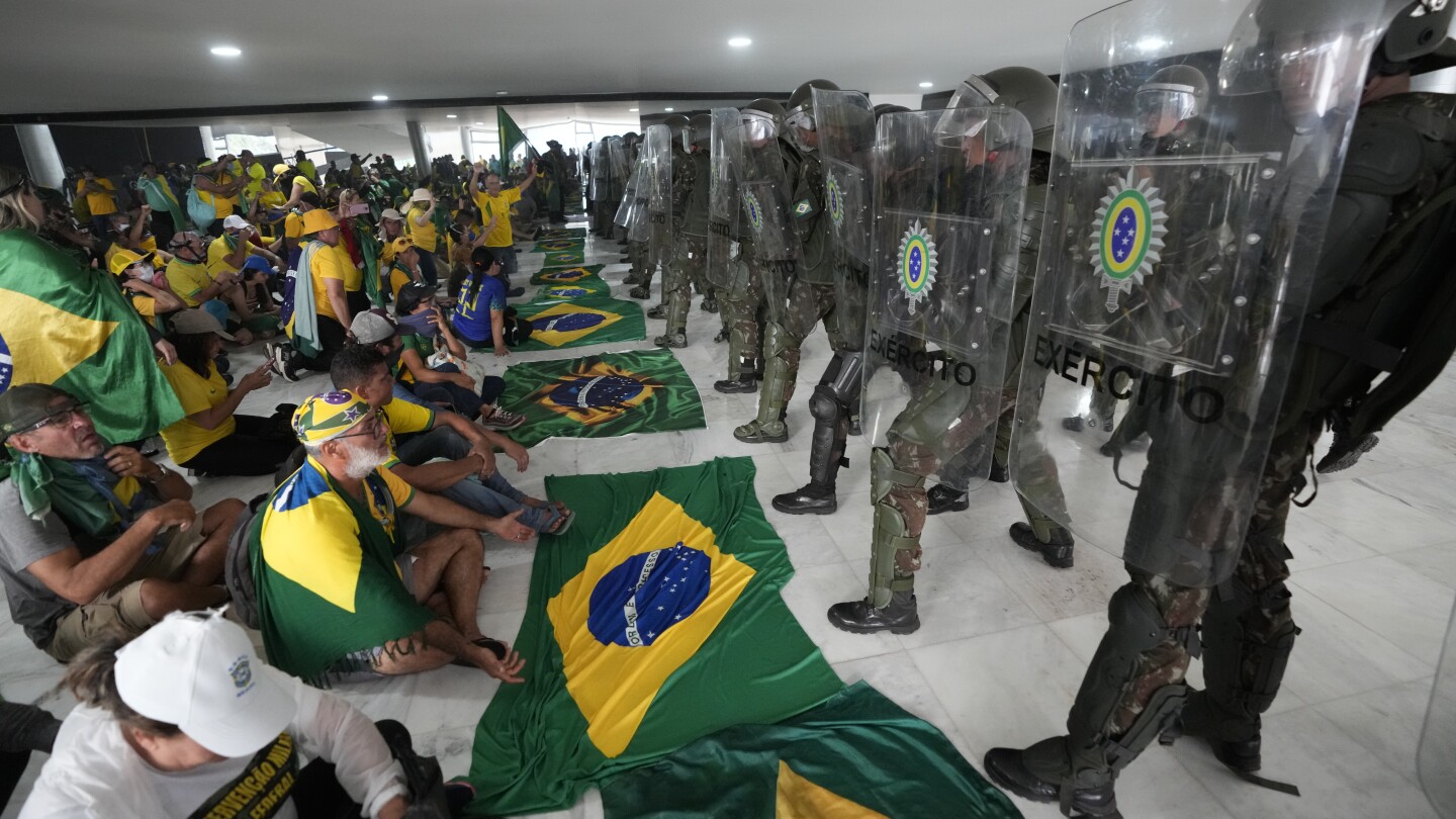 Pro-Bolsonaro rioters on trial for storming Brazil’s top government offices | AP News