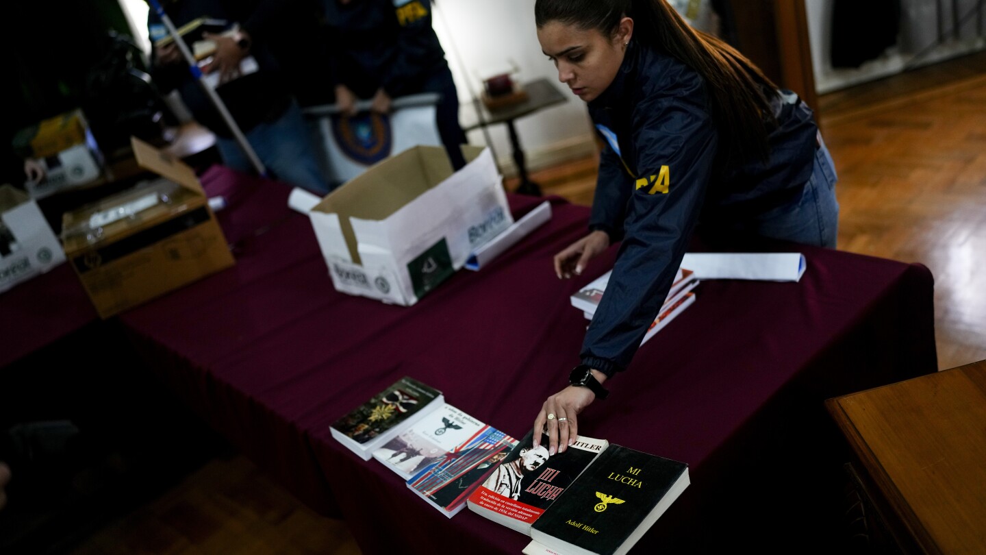 Argentina shuts down a publisher that sold books praising the Nazis. One person has been arrested | AP News