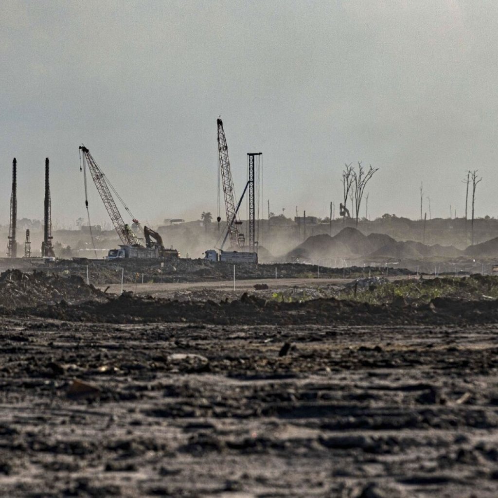 Reports show new Indonesian industrial park on Borneo, feted as ‘green,” will be powered by coal | AP News