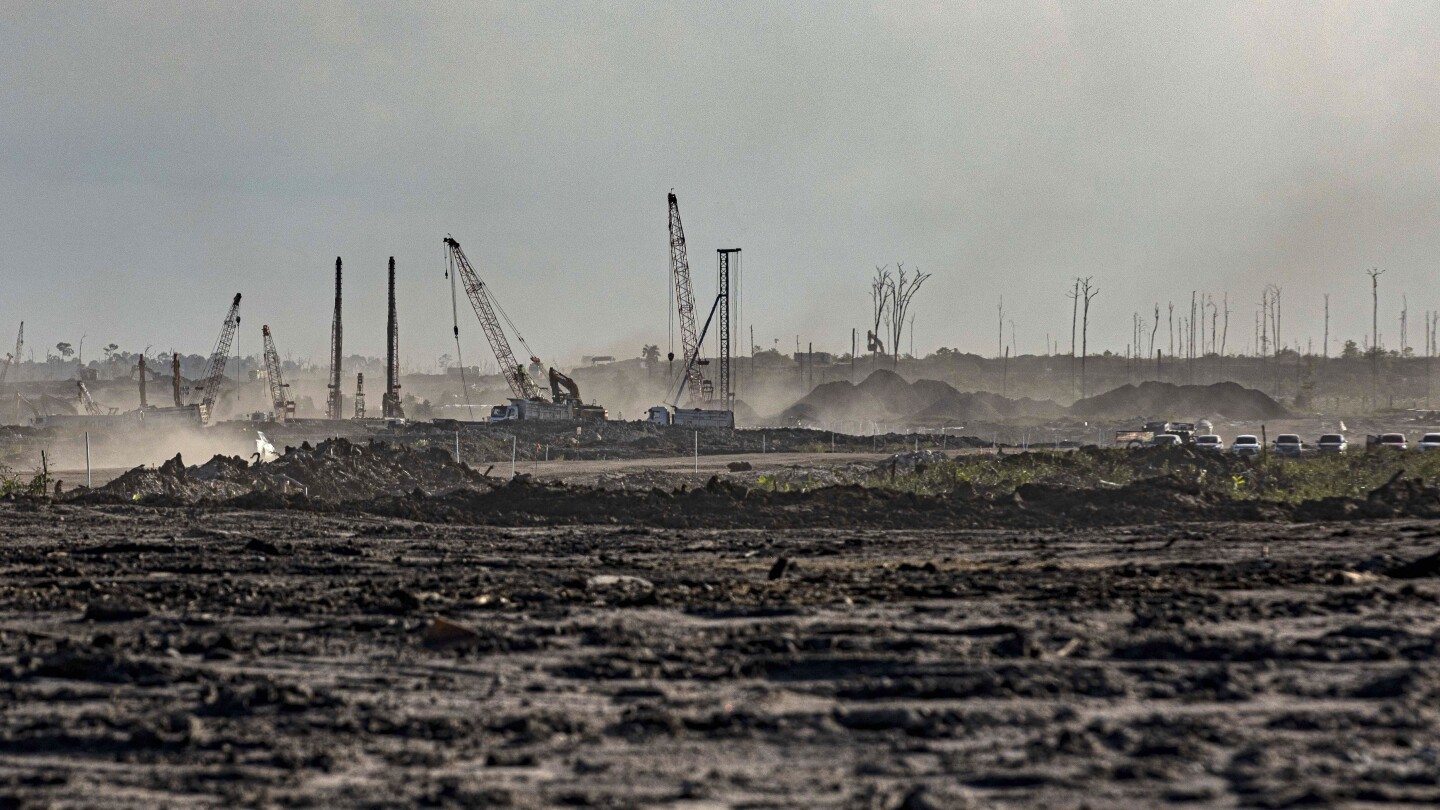 Reports show new Indonesian industrial park on Borneo, feted as ‘green,” will be powered by coal | AP News