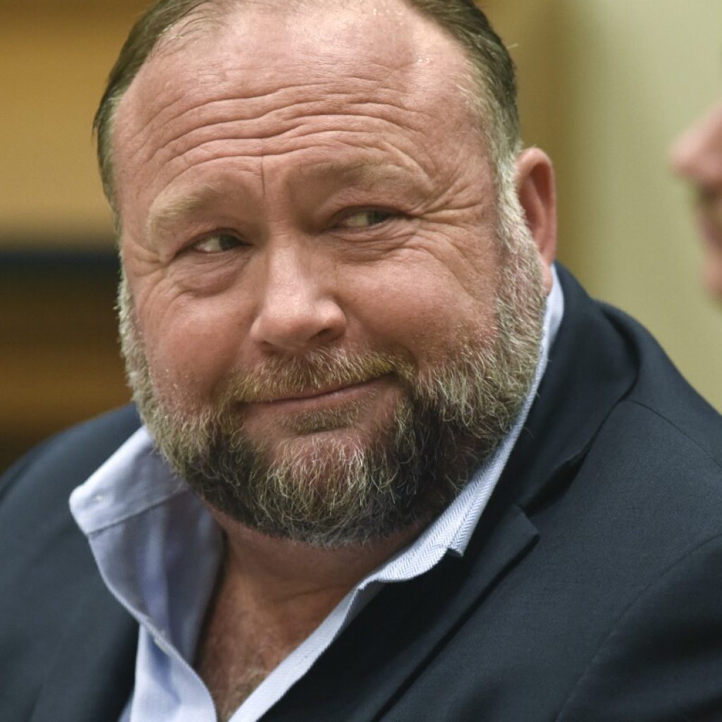 Alex Jones spent over $93,000 in July. Sandy Hook families who sued him have yet to see a dime | AP News