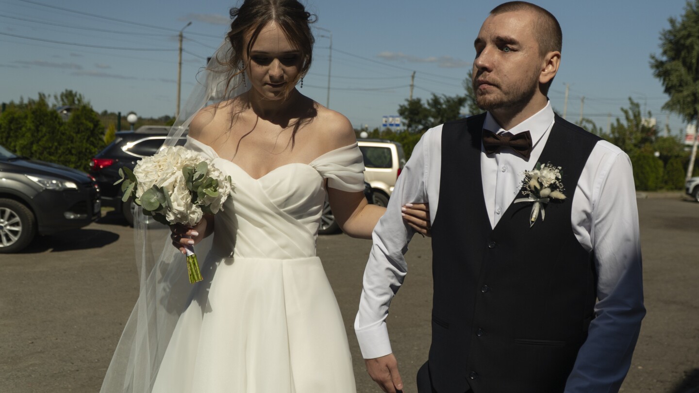 He couldn’t see his wedding. But this war-blinded Ukrainian soldier cried with joy at new love | AP News