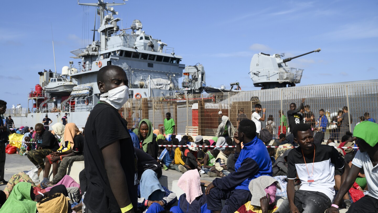 What’s behind the surge in migrant arrivals to Italy? | AP News