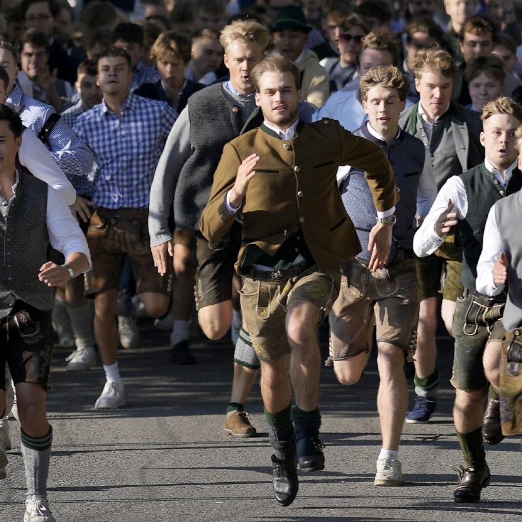 Beer flows and crowds descend on Munich for the official start of Oktoberfest | AP News