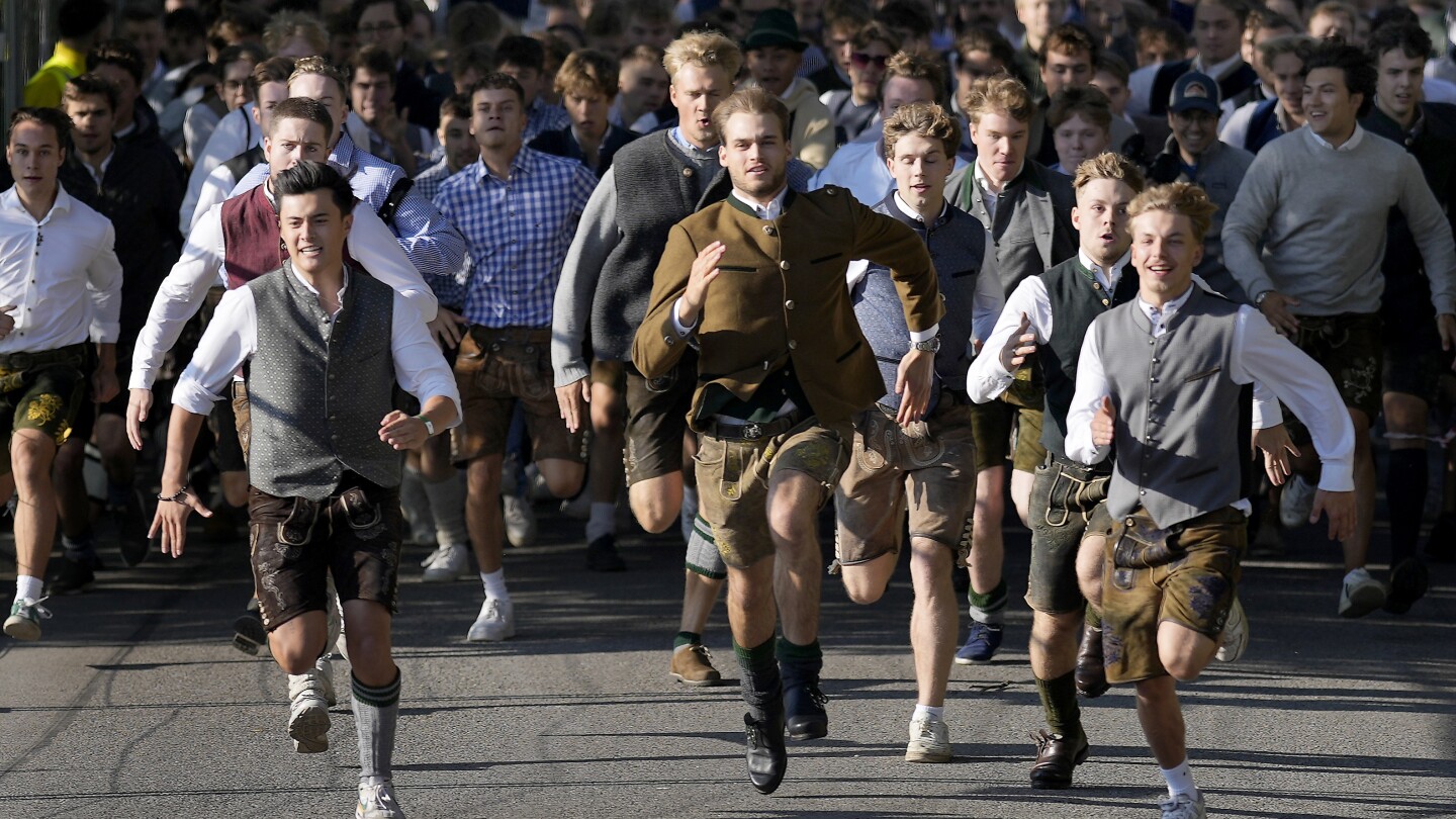 Beer flows and crowds descend on Munich for the official start of Oktoberfest | AP News