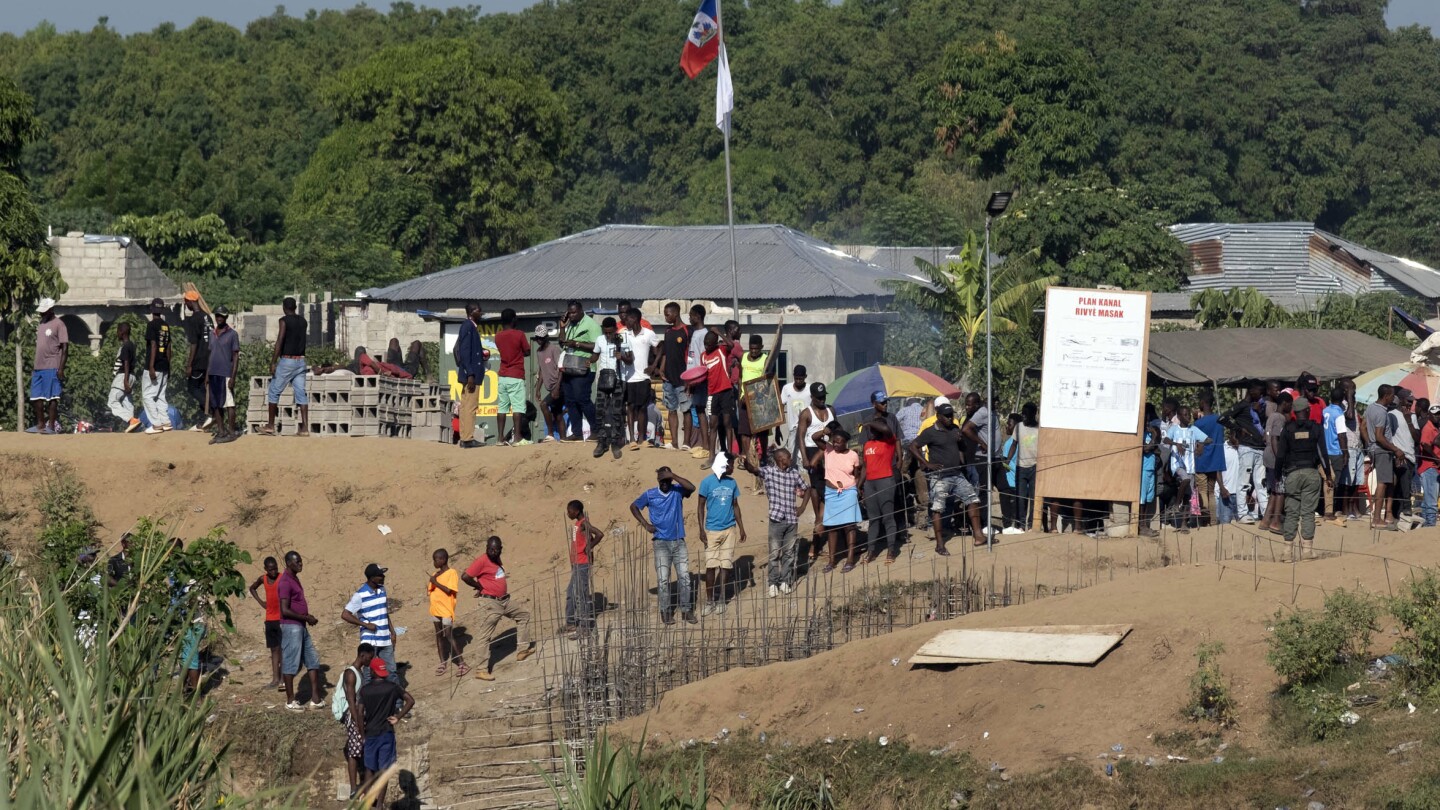 Dominican Republic closes all borders with Haiti as tensions rise in a dispute over a canal | AP News