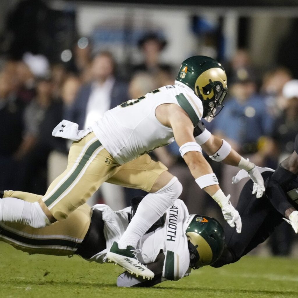 Colorado two-way star Travis Hunter taken to hospital during game after late hit vs CSU | AP News