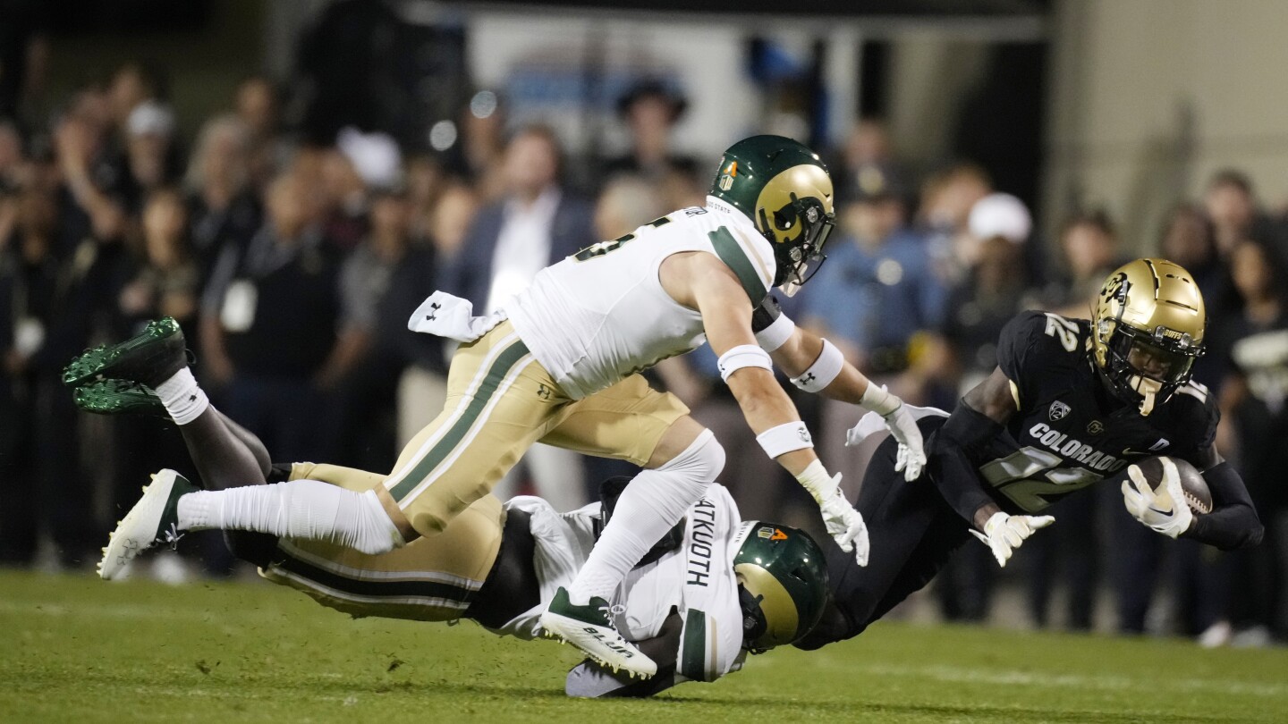 Colorado two-way star Travis Hunter taken to hospital during game after late hit vs CSU | AP News