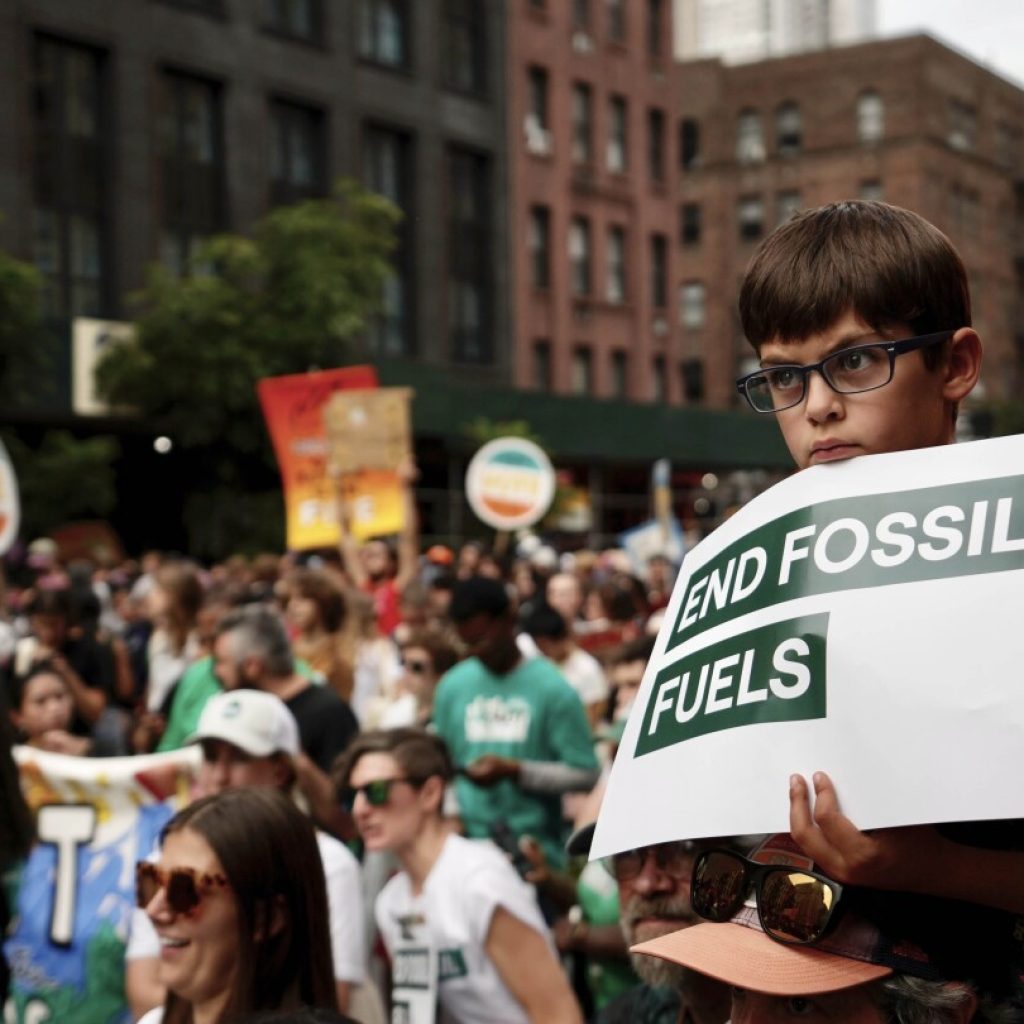 Tens of thousands march to kick off climate summit, demanding end to warming-causing fossil fuels | AP News