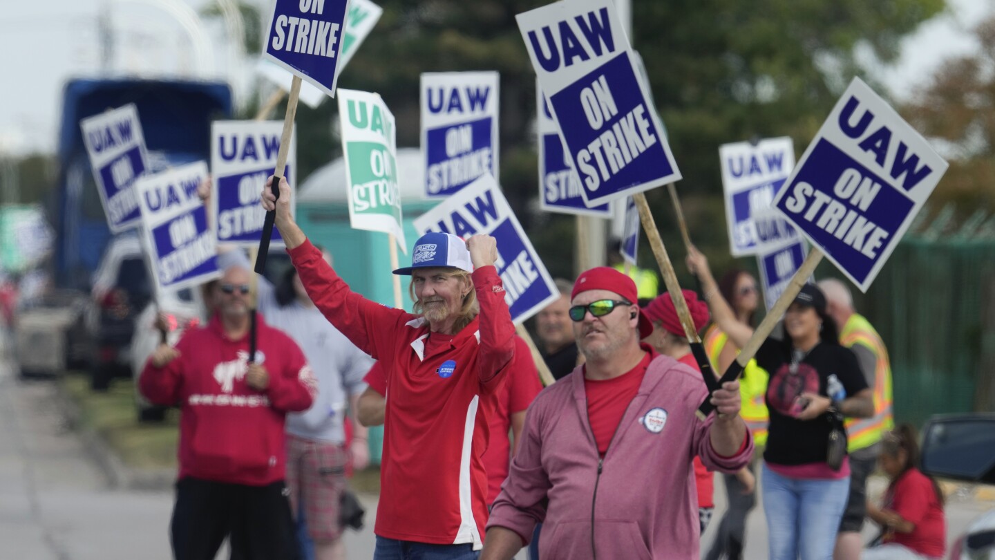 The strike by auto workers is entering its 4th day with no signs that a breakthrough is near | AP News