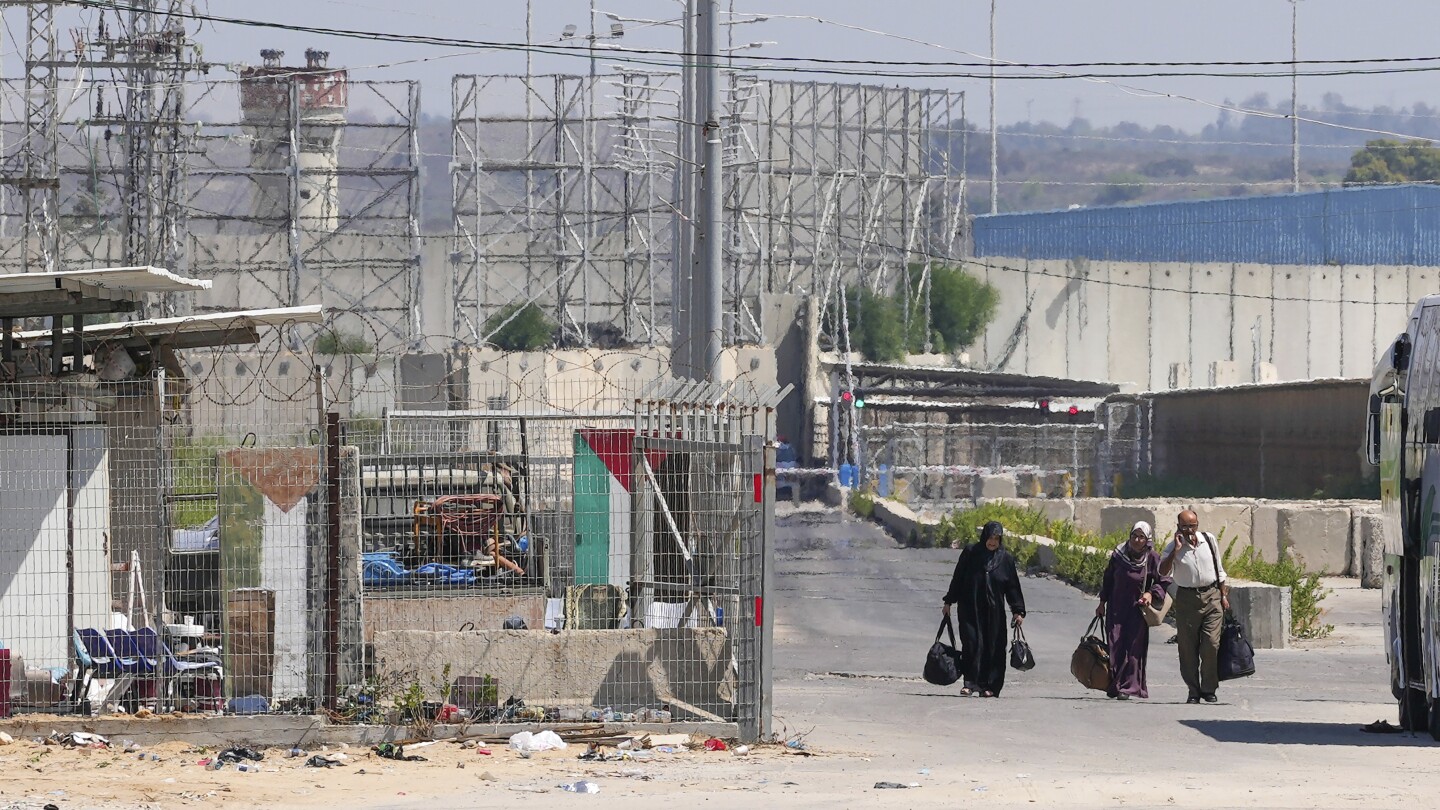 Israel shuts down main crossing with Gaza after outbreak of border violence | AP News