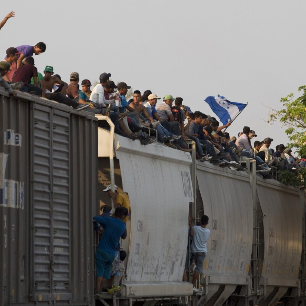 Mexican railway operator halts trains because so many migrants are climbing aboard and getting hurt | AP News