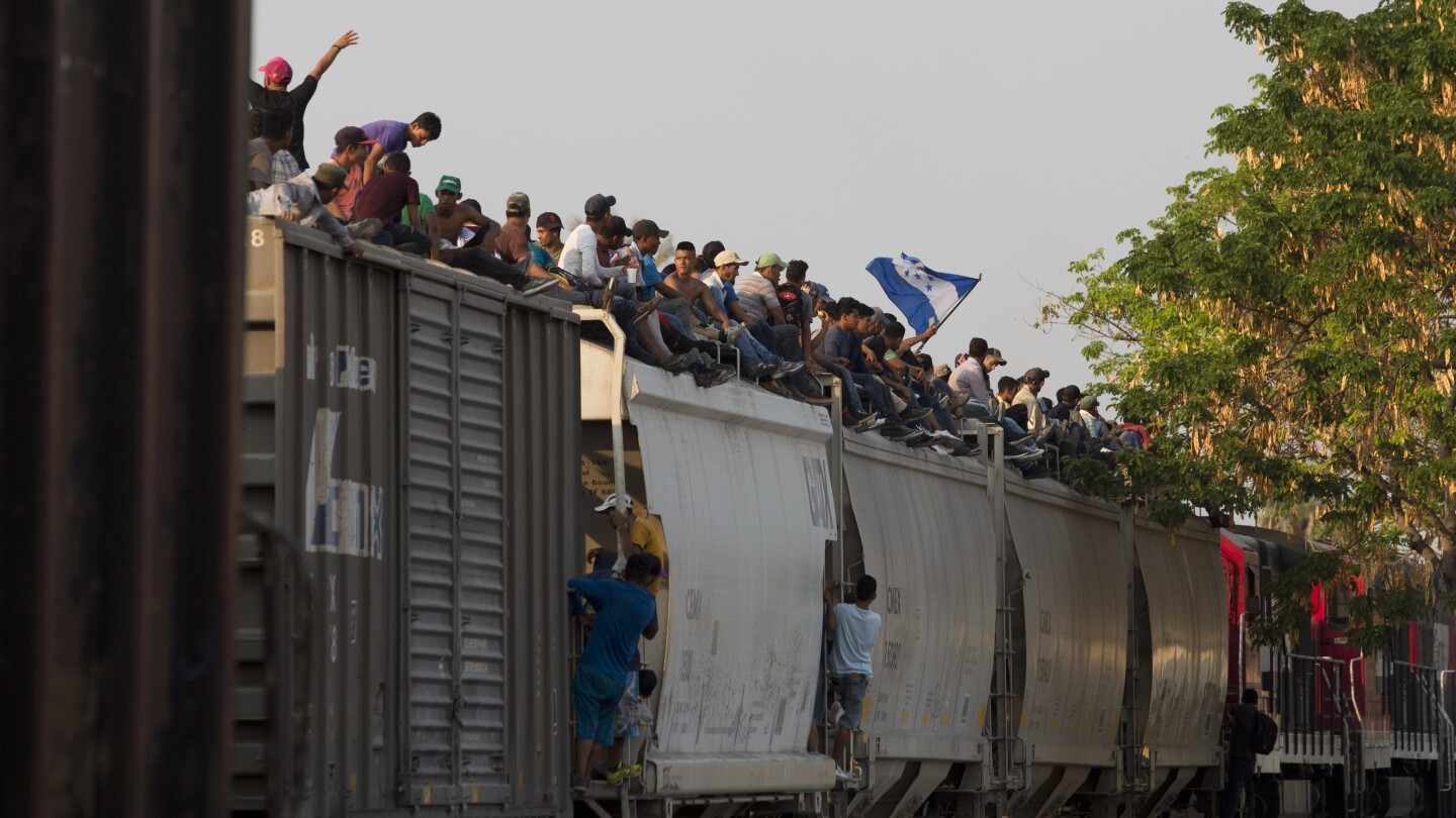 Mexican railway operator halts trains because so many migrants are climbing aboard and getting hurt | AP News