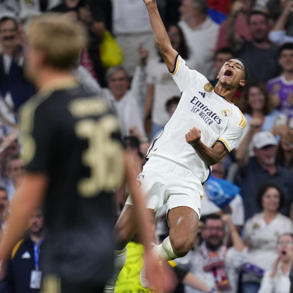 Bellingham scores in stoppage time to give Real Madrid win over Union Berlin in Champions League | AP News