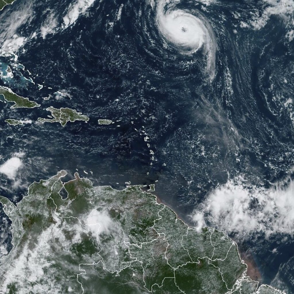 Rough surf batters Bermuda as Hurricane Nigel charges through open waters | AP News