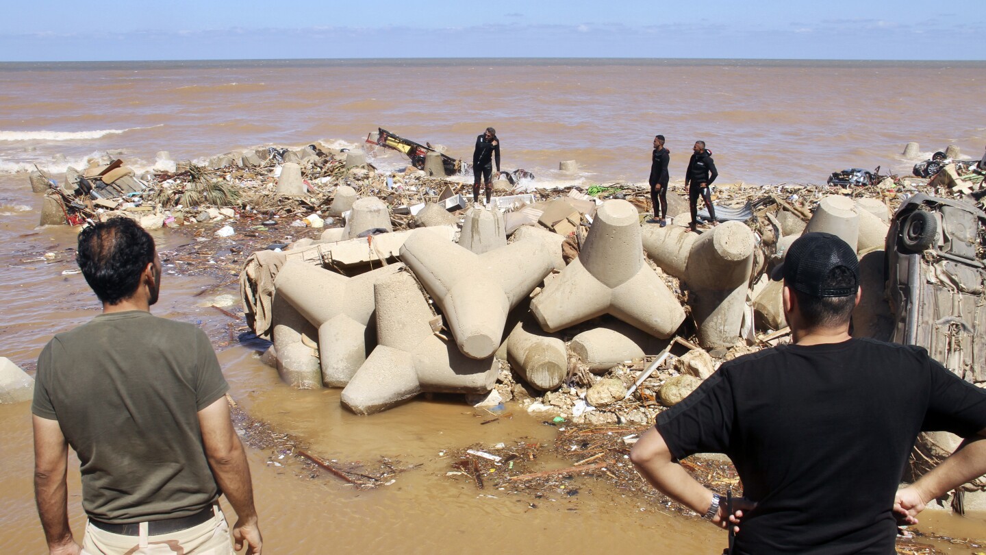 Communication outage hits flood-stricken city in Libya, further complicating search efforts | AP News