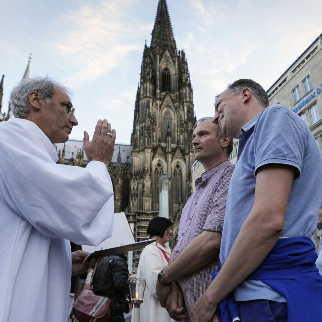 Catholic priests bless same-sex couples in defiance of a German archbishop | AP News