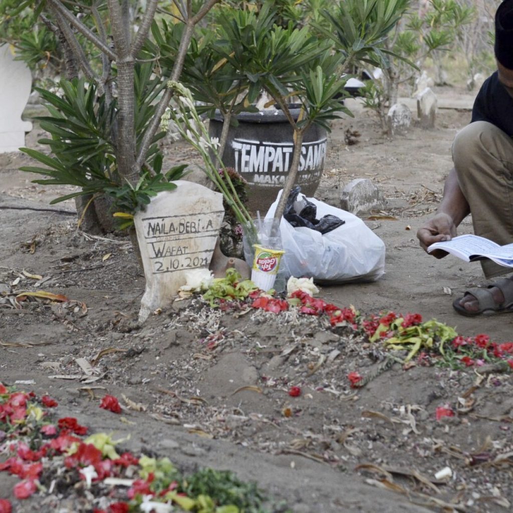 One year after deadly fan crush at Indonesia soccer stadium, families still seek justice | AP News