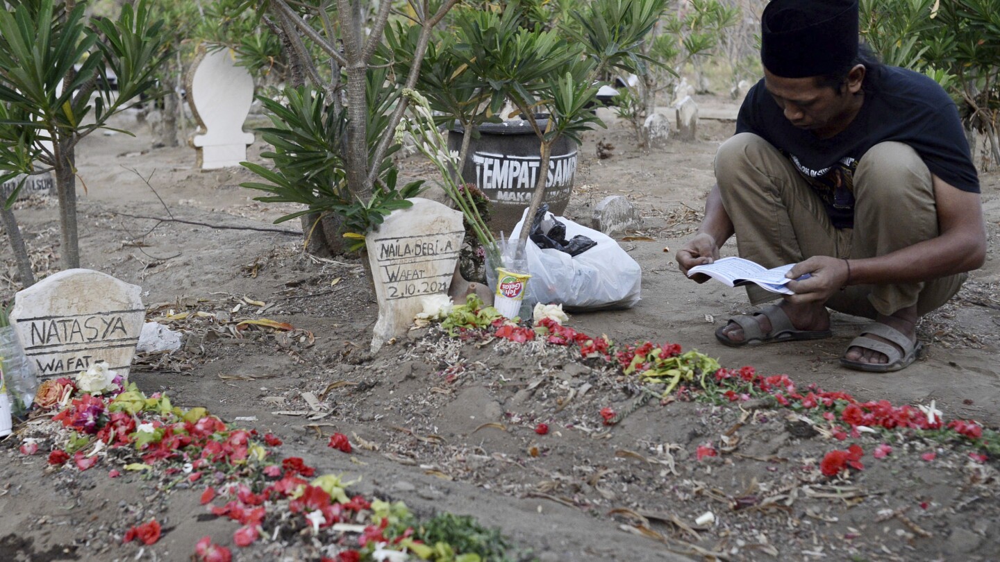 One year after deadly fan crush at Indonesia soccer stadium, families still seek justice | AP News