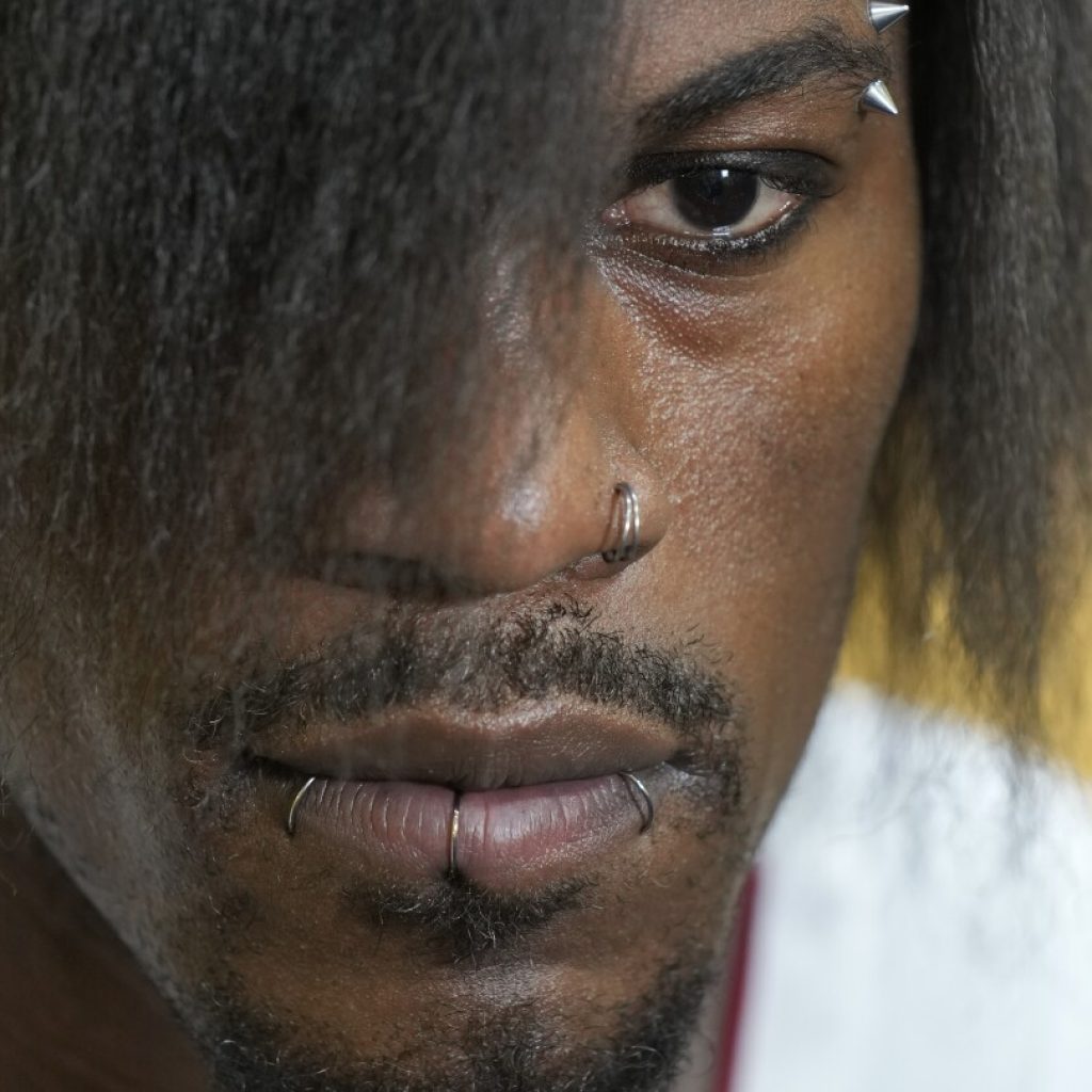 Jimmy Butler: See photos of his new look, hair, at Media Day | AP News