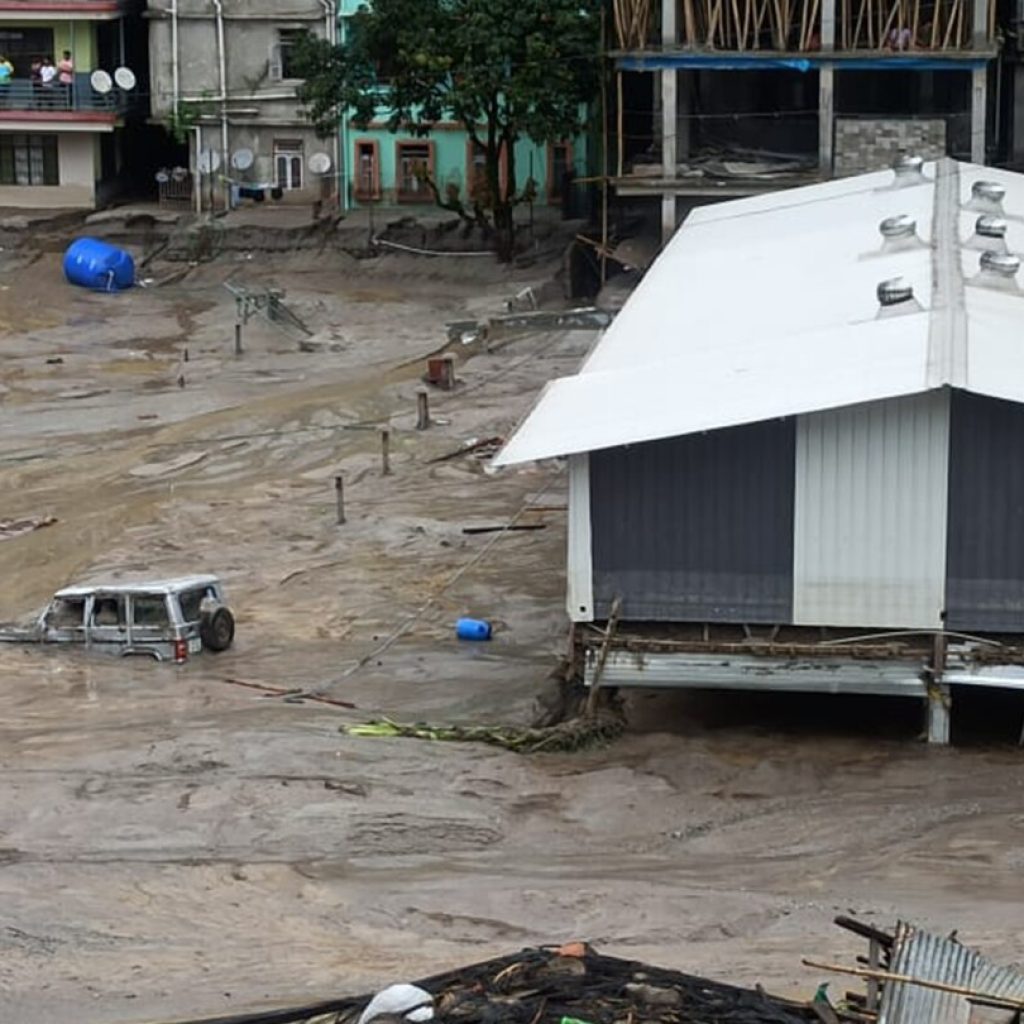 Icy floodwaters burst through major dam in India’s northeast, killing at least 31 people | AP News