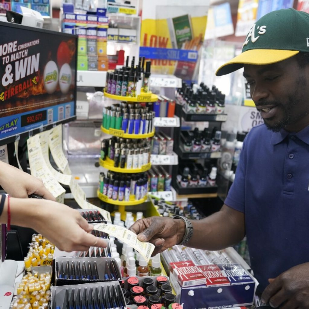 $1.4 billion Powerball prize is a combination of interest rates, sales, math — and luck | AP News