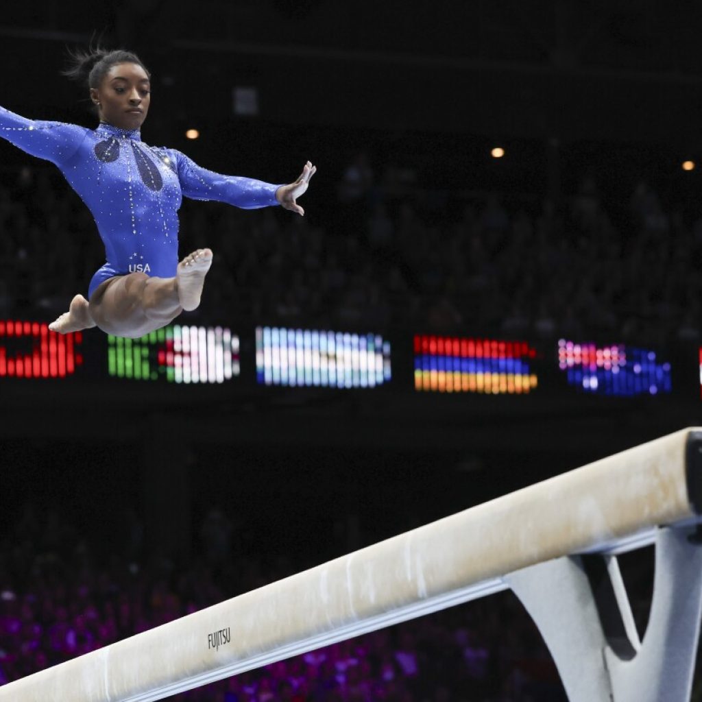 Simone Biles wins 6th all-around title at worlds to become most decorated gymnast in history | AP News