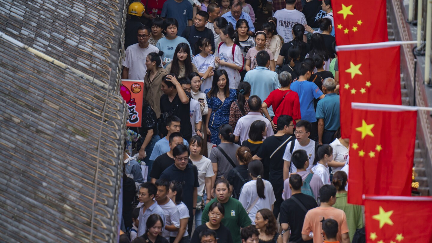 China’s flagging economy gets a temporary boost as holiday travel returns to pre-pandemic levels | AP News