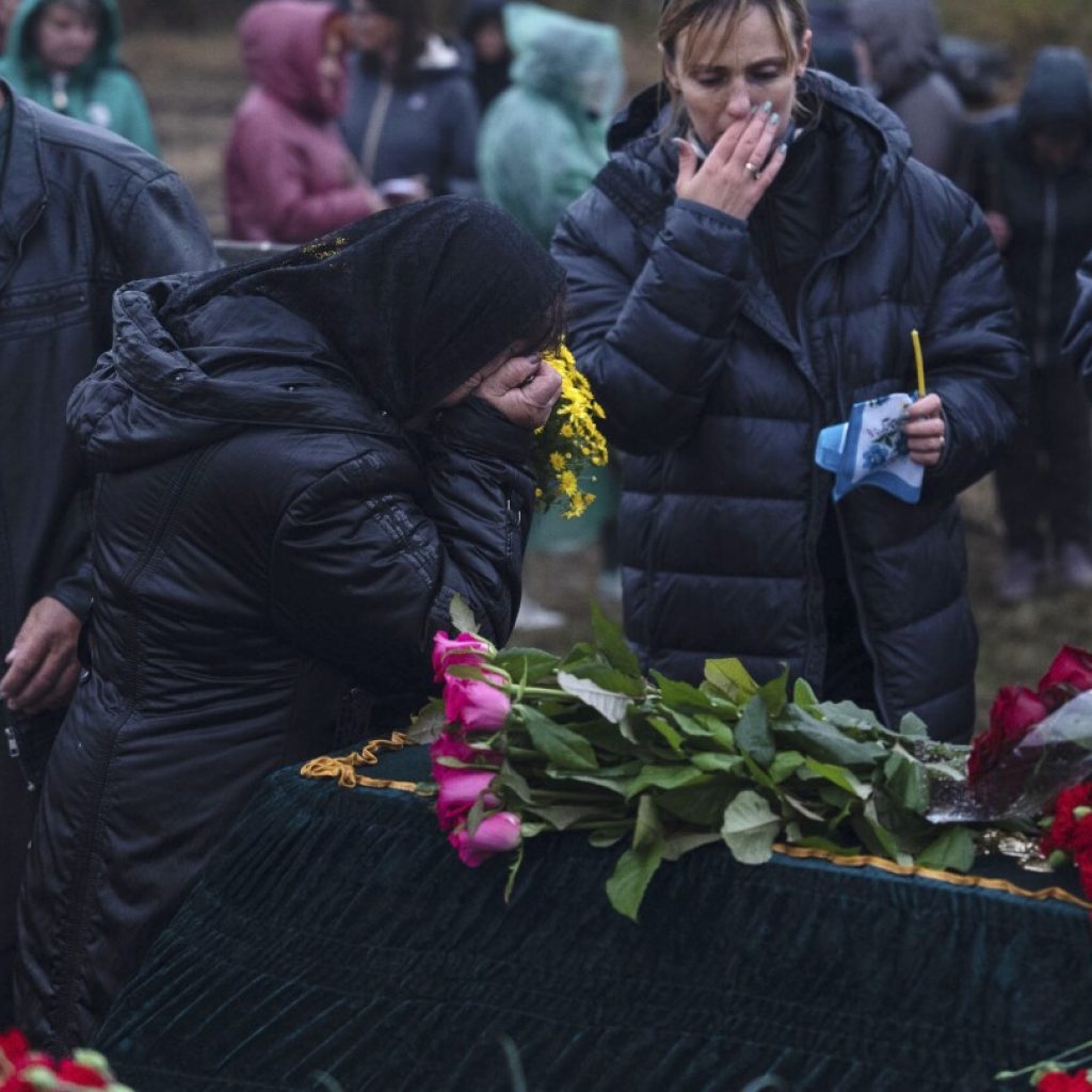 Days after deadly missile strike on Ukrainian cafe, grief and a search for answers | AP News