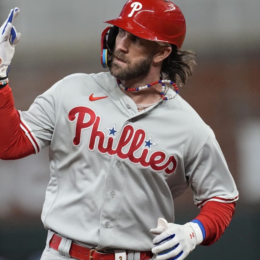 Harper homers, Phillies shut down slugging Braves 3-0 in Game 1 of NLDS | AP News