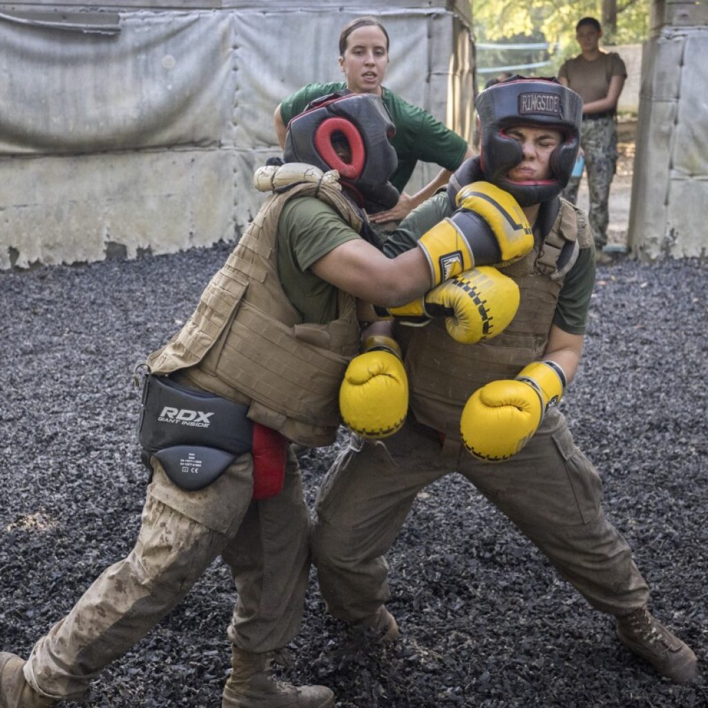 The Marines are moving gradually and sometimes reluctantly to integrate women and men in boot camp | AP News