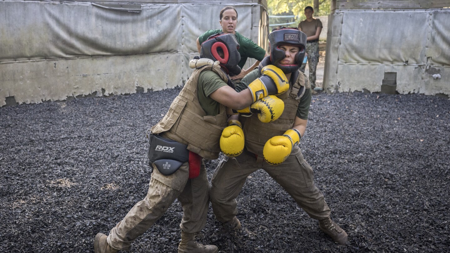 The Marines are moving gradually and sometimes reluctantly to integrate women and men in boot camp | AP News