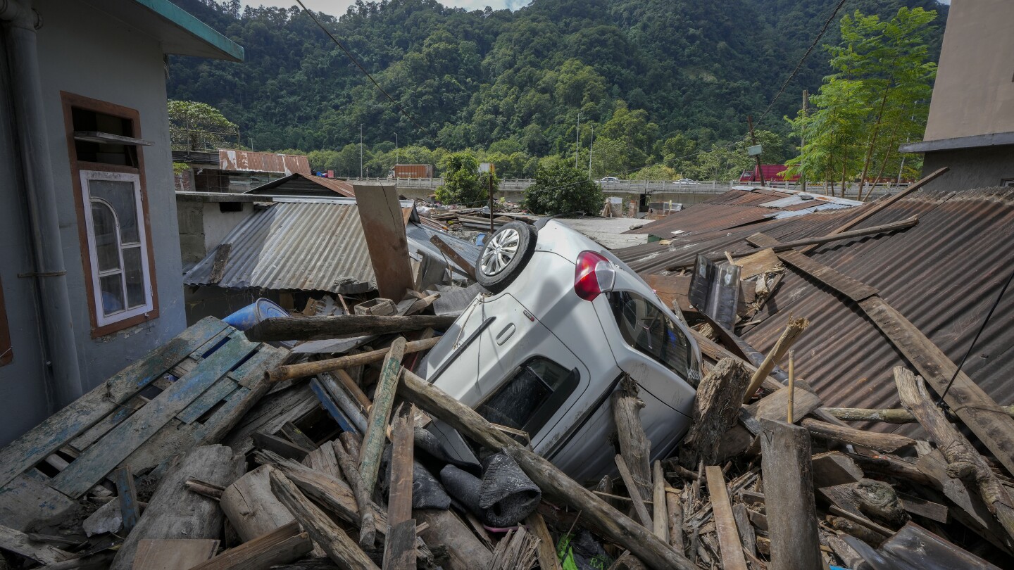 Indian rescue copters are flying into region where flood washed out bridges and killed at least 52 | AP News