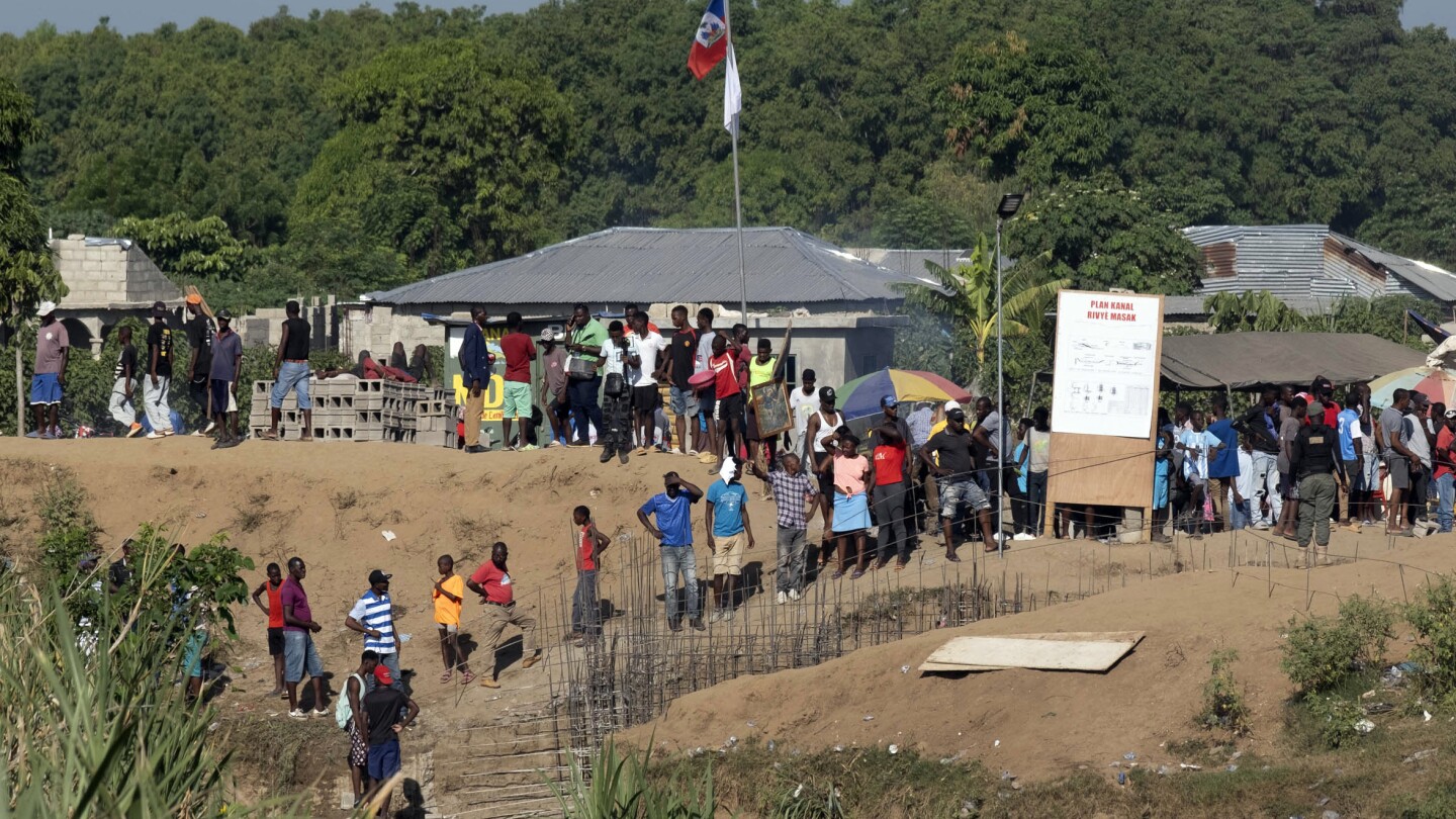 Dominican Republic to reopen its border to essential trade but not Haitians | AP News