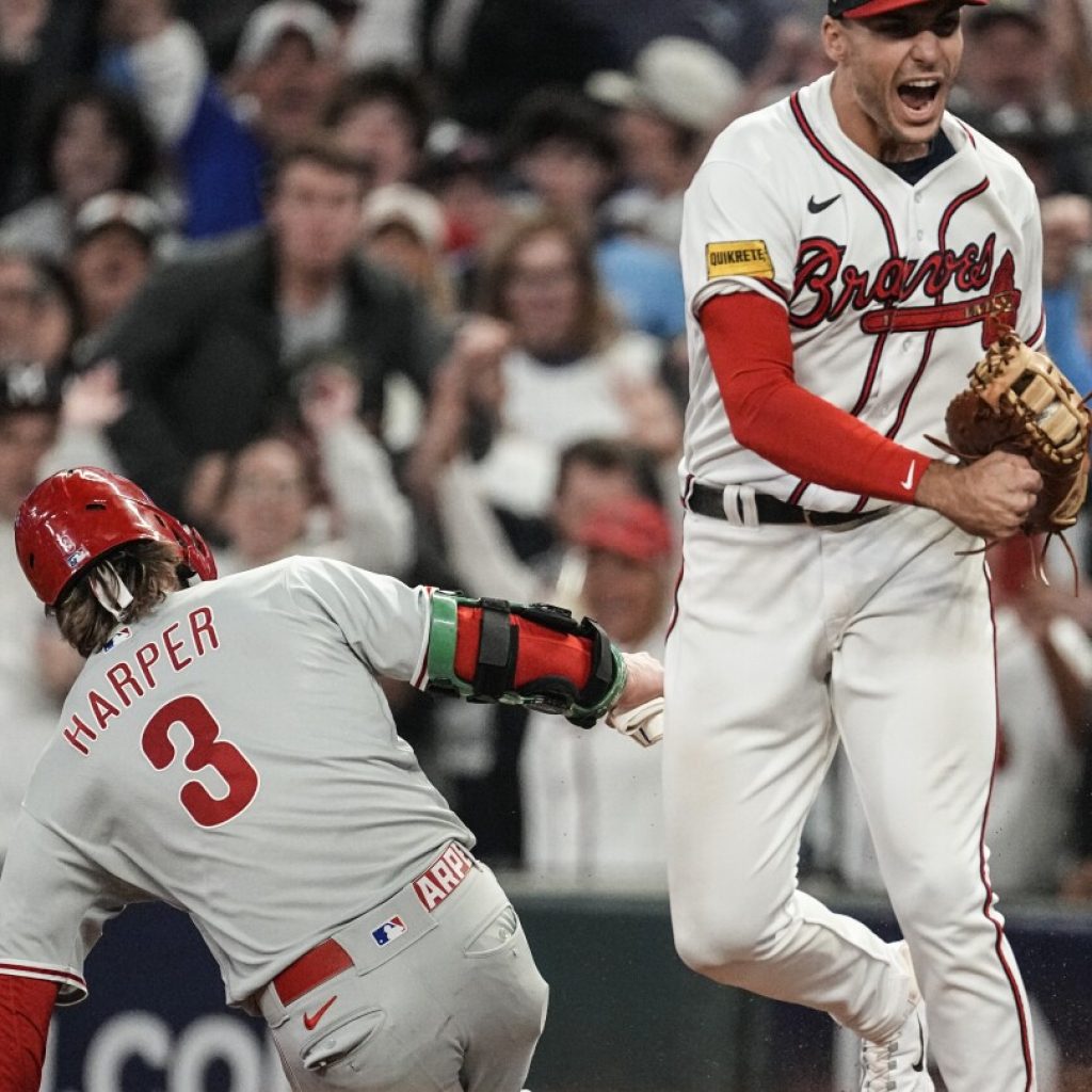 Braves rally for 5-4 win over Phillies on d’Arnaud, Riley homers and game-ending double play | AP News