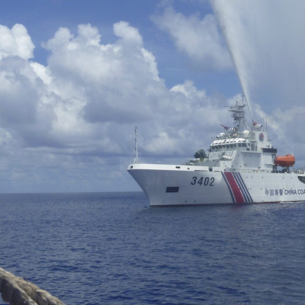 Chinese coast guard claims to have chased away Philippine navy ship from South China Sea shoal | AP News