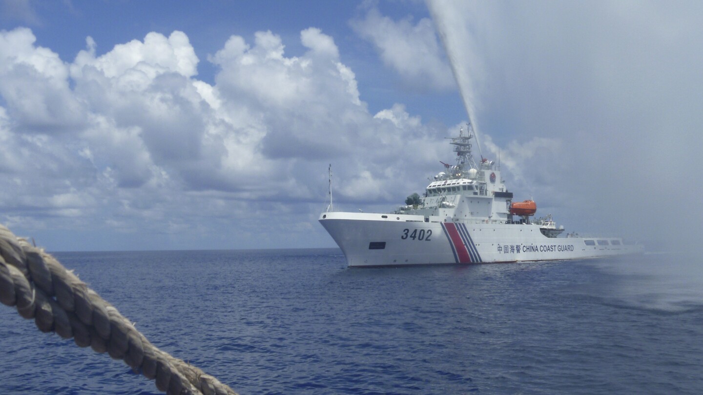 Chinese coast guard claims to have chased away Philippine navy ship from South China Sea shoal | AP News