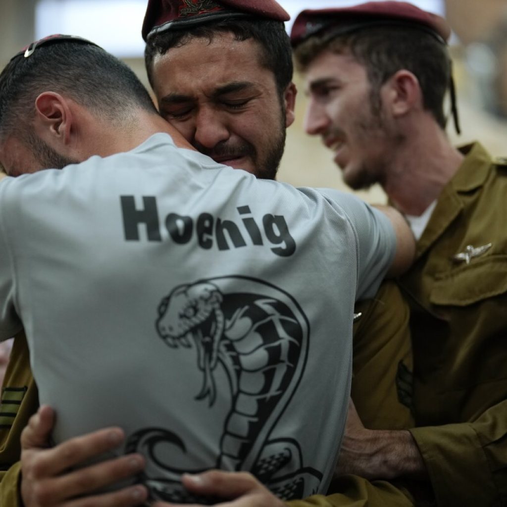 AP PHOTOS: Soldiers mobilize, mourners bury the dead as battles rage in Israeli-Palestinian war | AP News