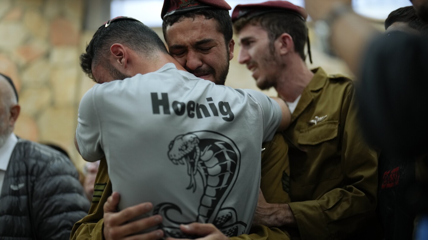 AP PHOTOS: Soldiers mobilize, mourners bury the dead as battles rage in Israeli-Palestinian war | AP News