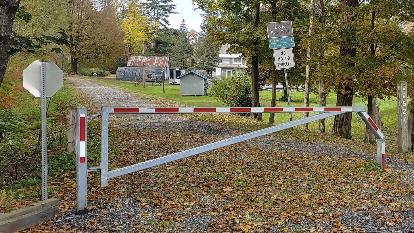 Police search for killer of retired Vermont college dean who was shot on trail near campus | AP News