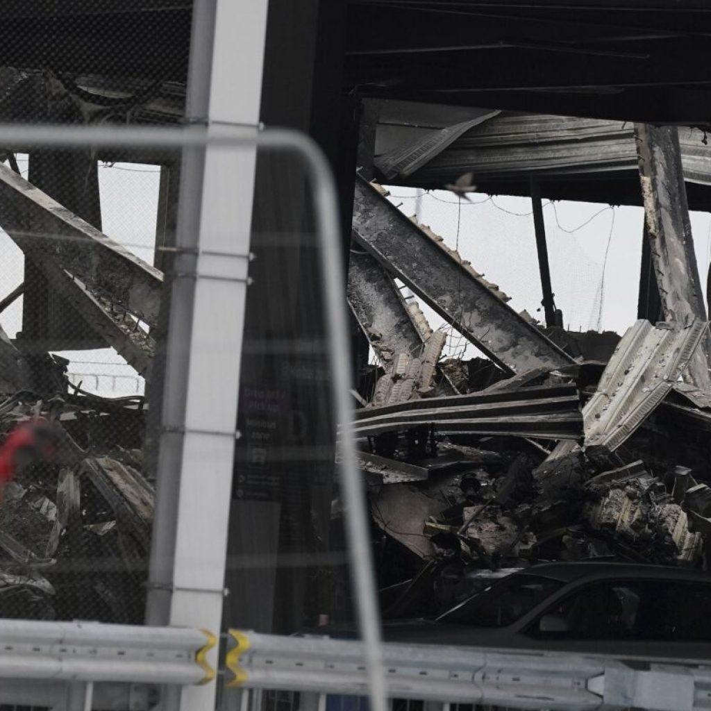 Dozens of flights are canceled after a fire rips through a parking garage at London’s Luton Airport | AP News