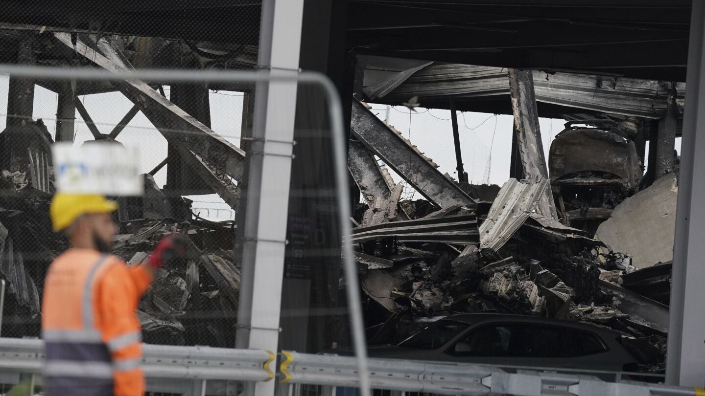 Dozens of flights are canceled after a fire rips through a parking garage at London’s Luton Airport | AP News