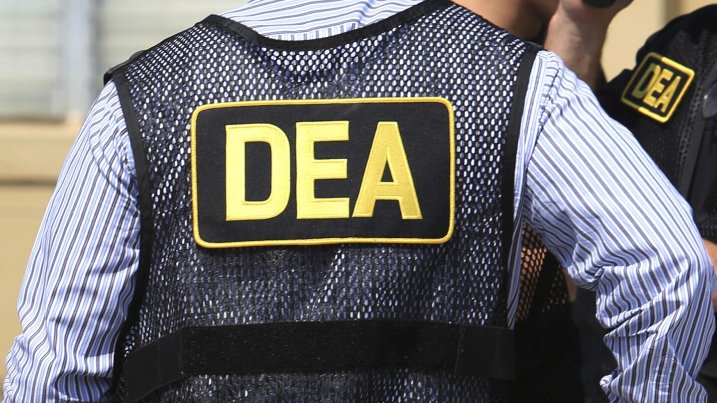 Shadowy snitch takes starring role in bribery trial of veteran DEA agents | AP News